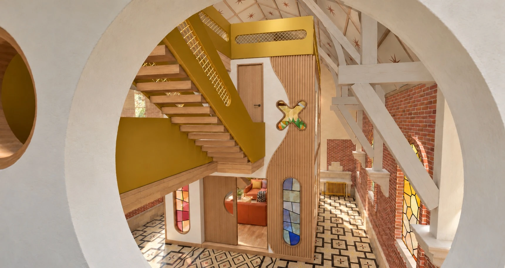 Le cube du chœur vu à travers une ouverture ronde, avec l’escalier jaune sous la charpente étoilée : rendu du futur gîte